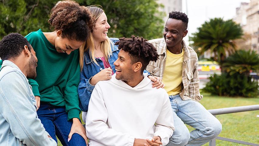 Happy multiethnic group of friends having fun outdoors