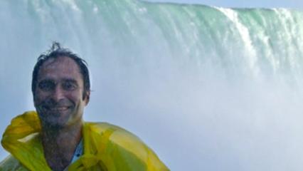 Dr. Keyantash in front of a magnificent waterfall